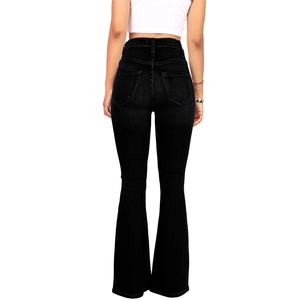 Detail view of high waist black flare jeans with slim fit design and back pockets