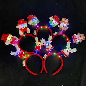 Macro shot of assorted LED Christmas headbands with Santa and Reindeer on black background