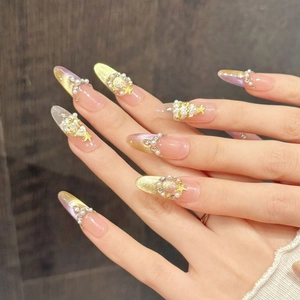 Pink gradient almond press-on nails with pearls, rhinestones and golden stars