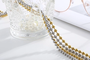 Close-up of gold and silver beaded anti-slip glasses chain with elegant luxury styling
