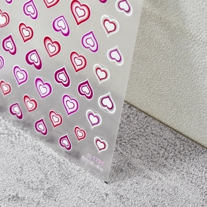 Pegatinas 5D para uñas con corazones degradados rosa y película adhesiva en superficie texturizada