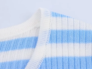 Detail of blue and white striped knit sweater neckline with ribbed sewing texture