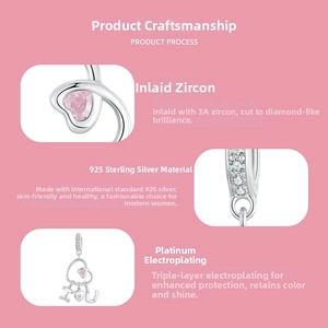 Macro detail of S925 sterling silver I Love You charm with pink heart-shaped zircon