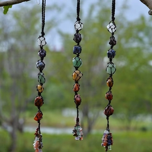 Detailed view of handmade chakra stones in black mesh for car or home decoration