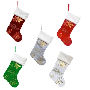 Set of five velvet Christmas stockings in festive colors with gold Merry Christmas print