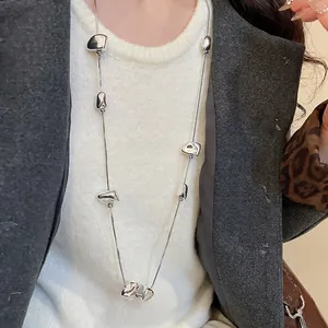 Y2K irregular square twisted necklace with shiny fluid metal pendants on long silver chain