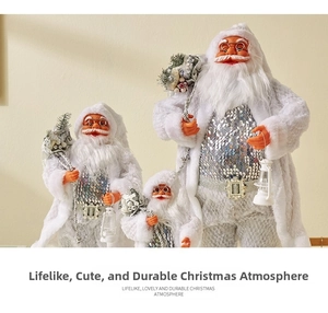 Detailed close-up of three Santa figurines in white faux fur and silver sequin vests