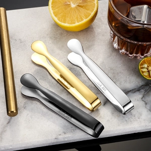 304 stainless steel ice tongs in gold, silver and black on marble surface
