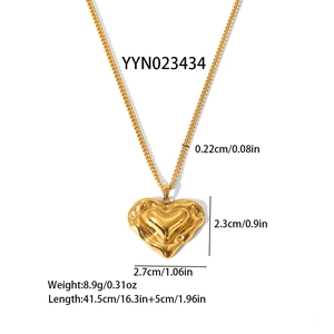 Modern gold stainless steel heart necklace with lava textured pendant and curb chain style
