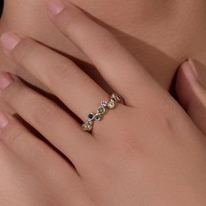 Elegant gold-plated S925 silver ring featuring colorful rainbow gemstones on a finger