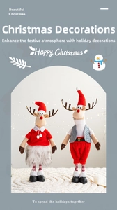 Detailed view of plush Christmas reindeer figurines in red and white festive holiday outfits
