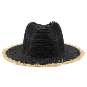 Close-up of black straw fedora hat featuring natural frayed edges and woven texture