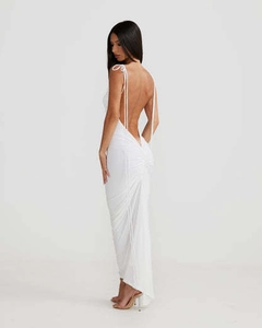 Detail of the back ruched design and slim fit of this white backless maxi dress