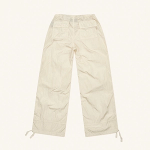 Off-white parachute wide-leg pants with back flap pockets and drawstring hem details