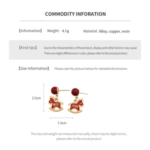 Detailed view of red rocking horse earrings with Chinese character and size specs