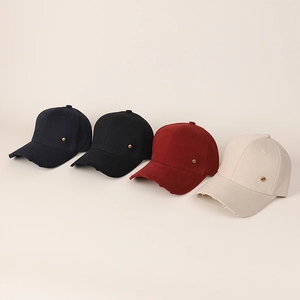 Detail view of four distressed cotton baseball caps in navy, black, wine, and beige colors