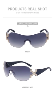 Detail of Y2K wrap-around rimless sunglasses with gradient lenses and rhinestone accents