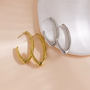 Minimalist C-shape geometric hoop earrings in gold and silver finish with shadow lighting