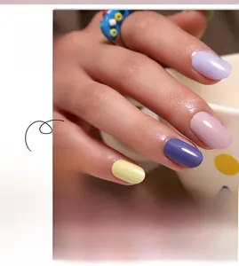 Close-up of macaron color press-on nails in purple, pink, yellow, and mint green shades
