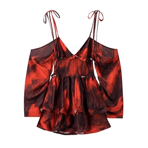 Detail of floral tie-dye off-shoulder top with ruffle sleeves and smocked chest