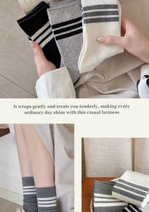 Detail showing high-quality combed cotton striped socks in black, grey, and white colors