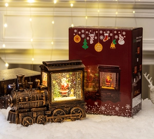 Luminous Christmas train crystal ball with festive gift box near a warm fireplace
