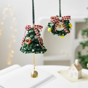 Handmade Christmas tree and wreath fabric ornaments with velvet texture and golden bells