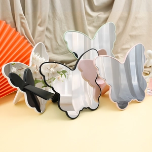 Butterfly shaped tabletop makeup mirrors in black, white, pink and green colors