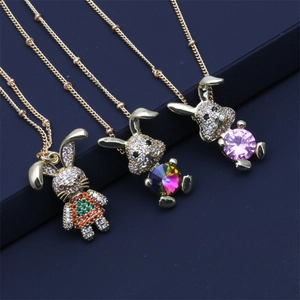 Detailed view of three gold rabbit necklaces featuring colorful zircon and gemstones
