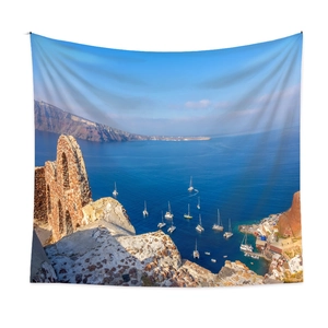 Detail view of large Santorini landscape tapestry showing white buildings and blue sea