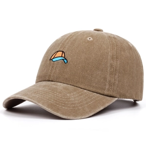 Close-up of khaki washed cotton baseball cap with orange and blue hat embroidery