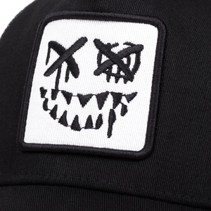 Black baseball cap with ghost face embroidery patch and cotton twill texture