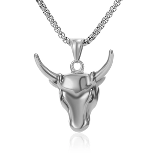 Detailed close-up of a silver bull head pendant with box chain and smooth reflection