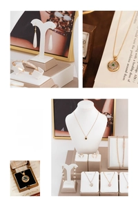 Detail shot of golden jewelry collection with emeralds and pearls on elegant display