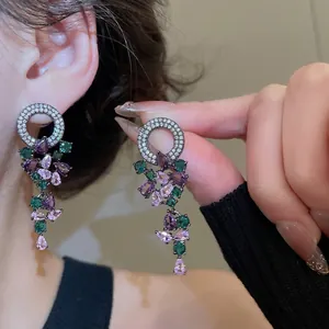 Elegant zircon tassel drop earrings featuring purple and green stones in a luxury style