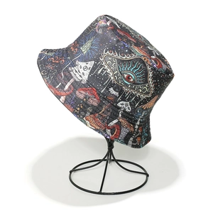 Detail of psychedelic mushroom print bucket hat with intricate starry eye illustrations