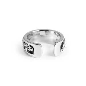 Detailed macro shot of vintage floral carvings on an adjustable 925 silver ring