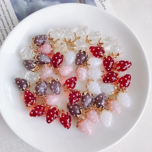 Mix of colorful resin strawberry pendants with pearl accents for DIY jewelry making
