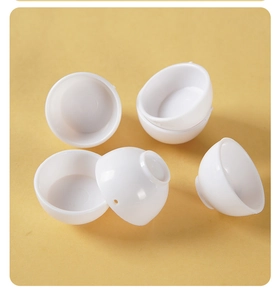 Detailed view of six miniature white plastic bowls for dollhouse and DIY miniature scenes