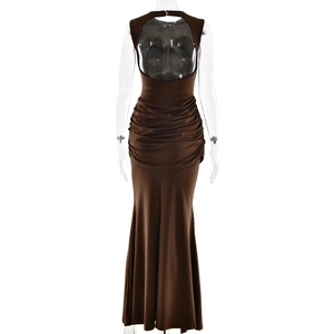 Detail view of the backless brown maxi dress featuring pleated waist and halter neck