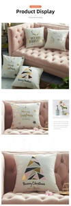 Close-up of gold foiled Christmas pillow covers with festive geometric patterns