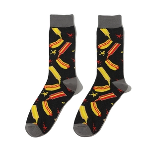 Detail showing knit hot dog and condiment bottle patterns on black mid-calf socks