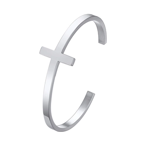 Minimalist silver C-shape stainless steel cuff bracelet with cross design on white background