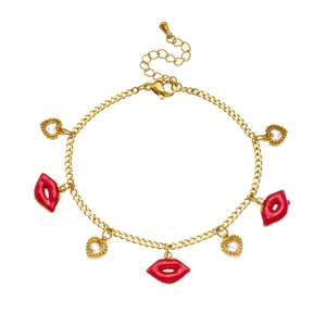 Gold chain bracelet featuring a red lip enamel charm and heart-shaped crystal stone