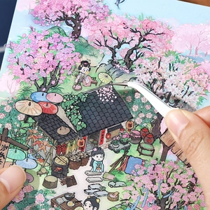 Autocollants de paysage chinois DIY montrant l'application de pétales sur un toit