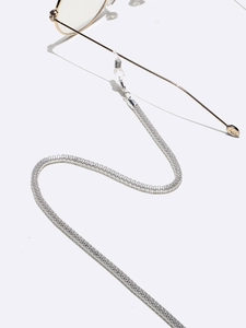 Detail view of 4mm silver metal mesh eyeglass chain with flexible silicone connectors