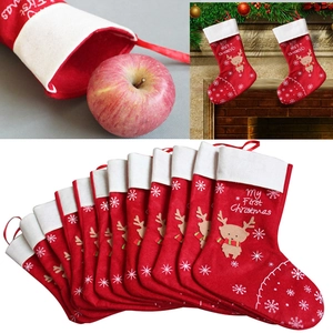 Felt reindeer Christmas stockings for mantel decor featuring snowflakes and white trim