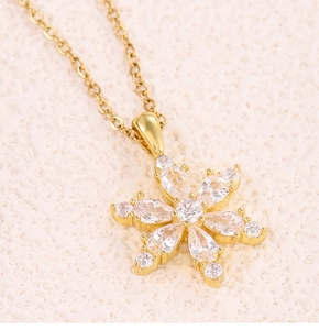 Detailed view of a gold flower pendant necklace with brilliant zircon gemstone petals