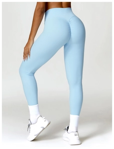 Detail view of high waisted light blue yoga pants with scrunch butt lifting design
