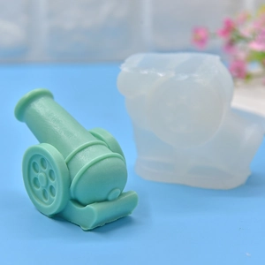 Artillery cannon silicone mold for DIY candles and plaster ornaments with green finished product